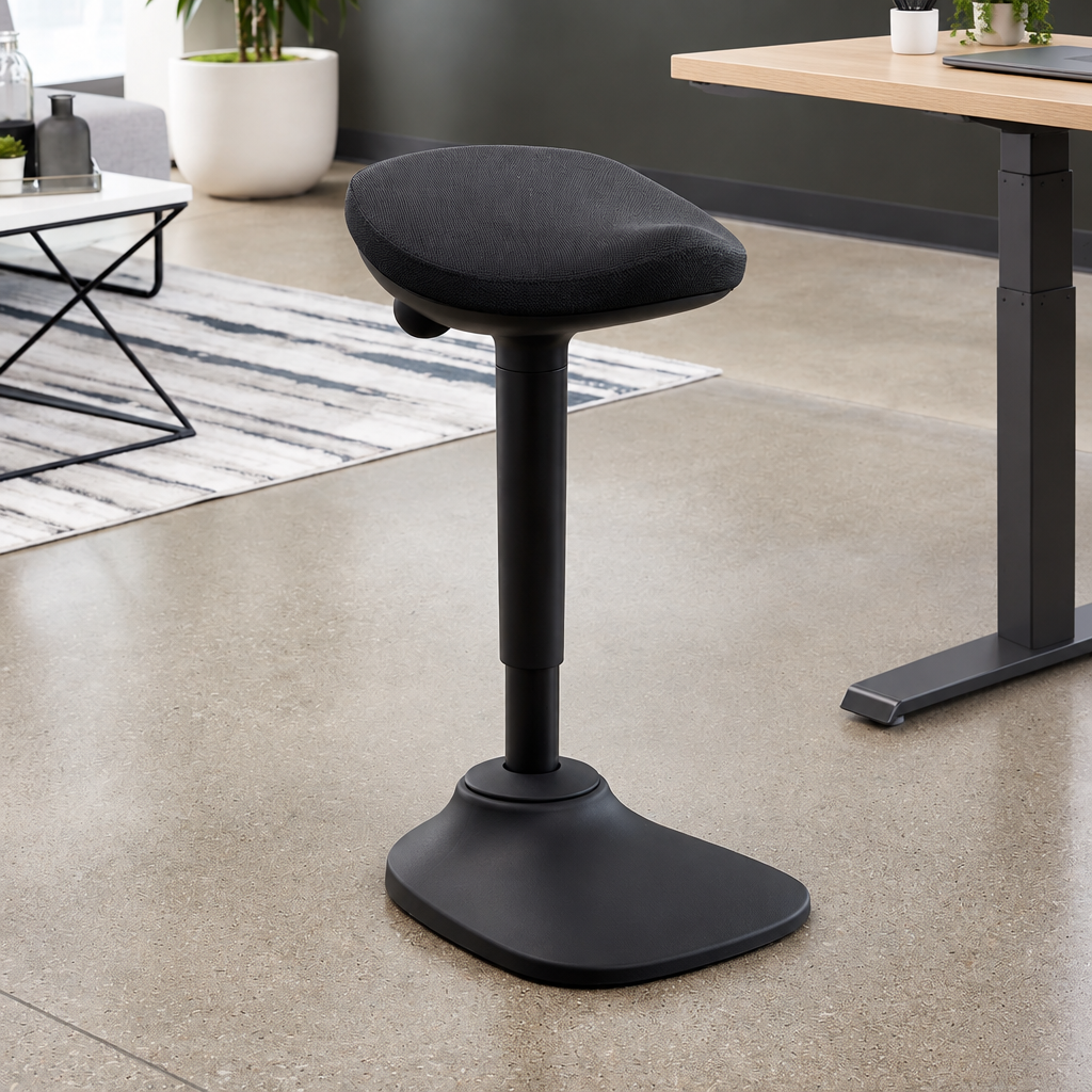 Black Ergox EA-R15-BK wobble perch stool beside a standing desk