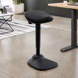 Black Ergox EA-R15-BK wobble perch stool beside a standing desk